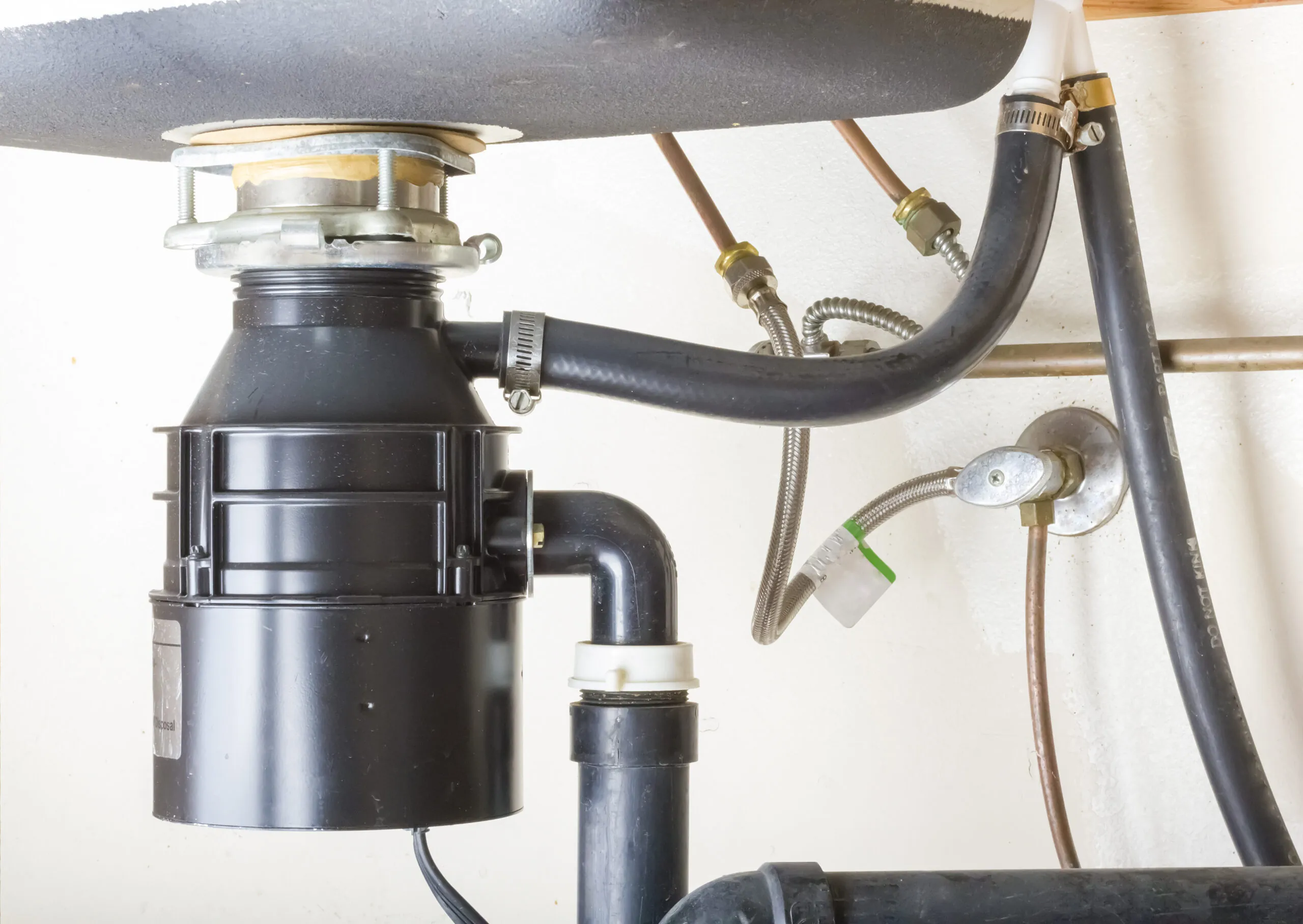 Under-the-sink garbage disposal unit.
