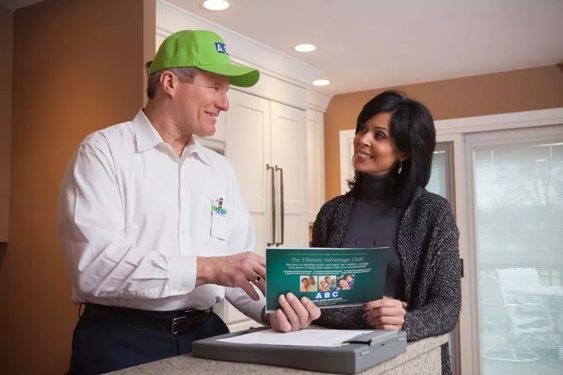 ABC technician speaking with homeowner about service options