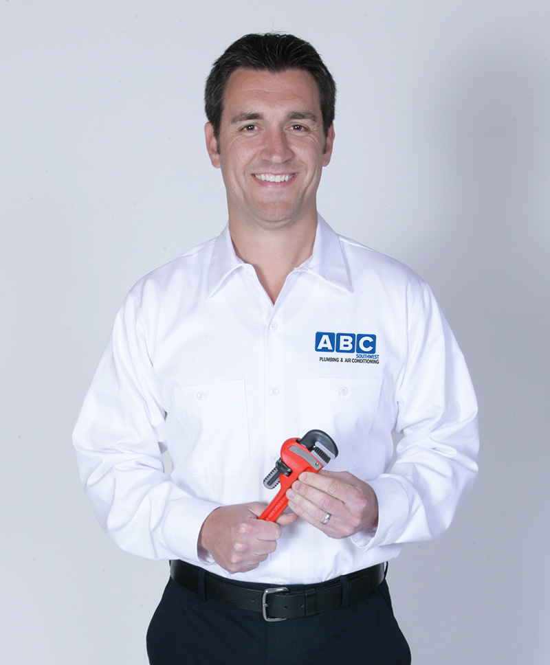 ABC Southwest technician posing with a wrench