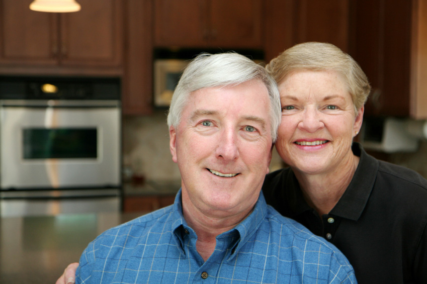 couple smiling in kitchen